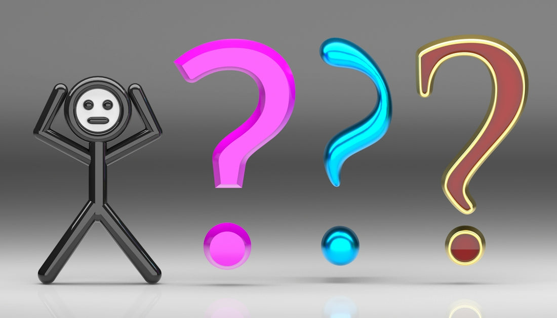 A black stick figure with hands on head beside three colorful question marks